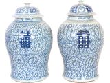 pair of blue and white vases with chinese characters on them