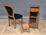 two chairs and a cabinet on a parquet floor