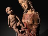 a statue of a woman holding a child in her arms