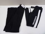 a pair of black pants with white and black logos on them