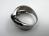 an image of a silver ring on a white surface