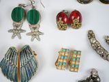 a lot of jewelry on a white surface
