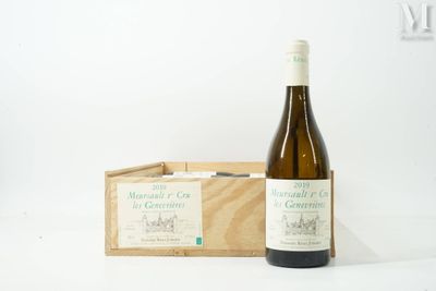 a bottle of wine sitting next to a wooden box