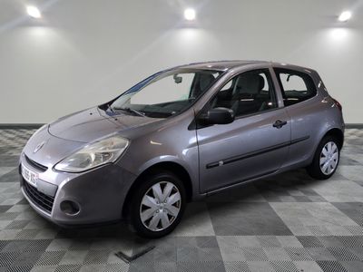 a picture of a silver car parked in a garage