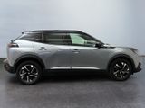 a silver suv is parked in a room with a gray floor