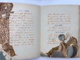 an open book with a drawing of a man sitting on a bench