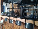 a bar with a bunch of chairs in front of it