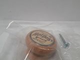 a small wooden object in a plastic bag on a table