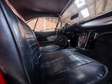 a view of the inside of a car from the driver ' s seat