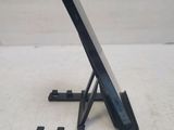 a cell phone sitting on a stand on a table