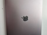 a silver laptop with an apple logo on the screen