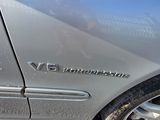 a close up of a car ' s emblem on the side of the car