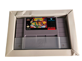an old nintendo game in a box on a white surface