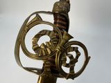 an image of a close up of a metal object with a clock on it
