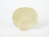 an image of a white plate on a stand on a white surface