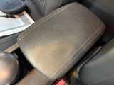 an image of a car seat with a remote control in it