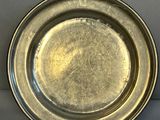a silver plate that is sitting on a table
