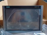 a microwave that is sitting in a box on the ground