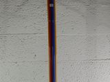 a multicolored coat rack on a white surface