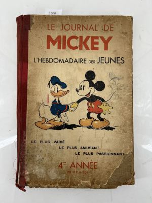 walt and mickey mouse book on a white surface
