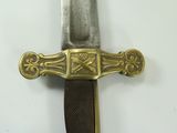 a close up of a knife on a white surface