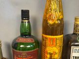 many different types of alcohol bottles on a shelf