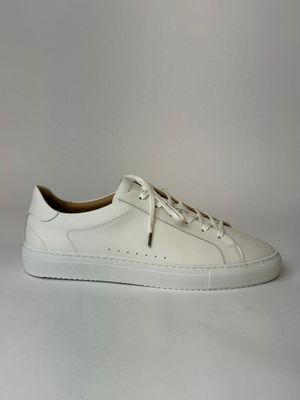 the white sneakers are on a white surface with a white background