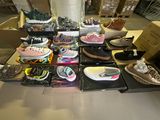 many different types of shoes on display in a store