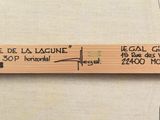 a close up of a wooden stick with a label on it