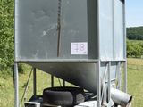 a large metal container with a tire on top of it