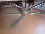 an image of a metal table with a glass top
