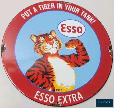a sign that says put a tiger in your tank esso extra