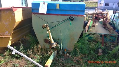 two boats that are sitting in the grass