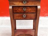 an old wooden table with a drawer on top of it