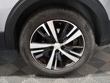 a close up view of a car ' s wheel on the ground