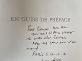 someone is writing a poem on a piece of paper that is on a table