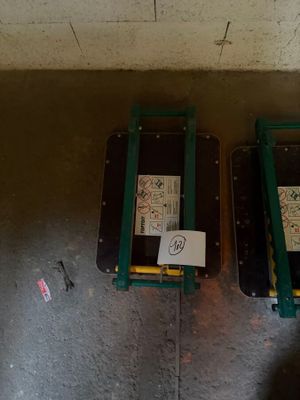 two pieces of luggage sitting on the floor next to each other