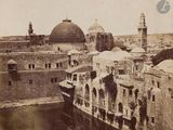 an old photo of a view of a city from the top of a hill
