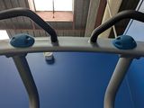 a close up of a gym equipment with a blue floor