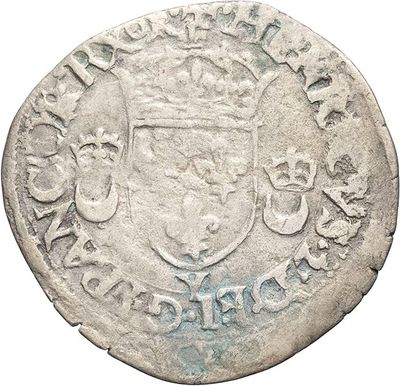 a close up of a coin with a crown on it