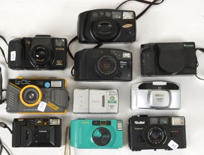 many different types of cameras sitting on a table