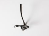 an image of a metal hook on a white wall