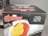 a box with a cake shaped like a iron man on it