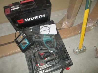 a tool kit that is sitting on the floor next to a tool box