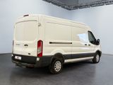a white van that is parked in a room