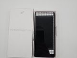 an open box with a phone inside of it sitting on a table