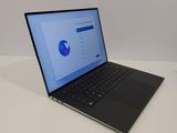 a laptop that is sitting on a table with a mouse