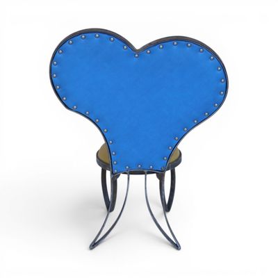 blue heart shaped chair with metal legs on a white background