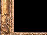 an ornate gold frame with a black background