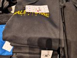 a lot of t - shirts that are on a table
